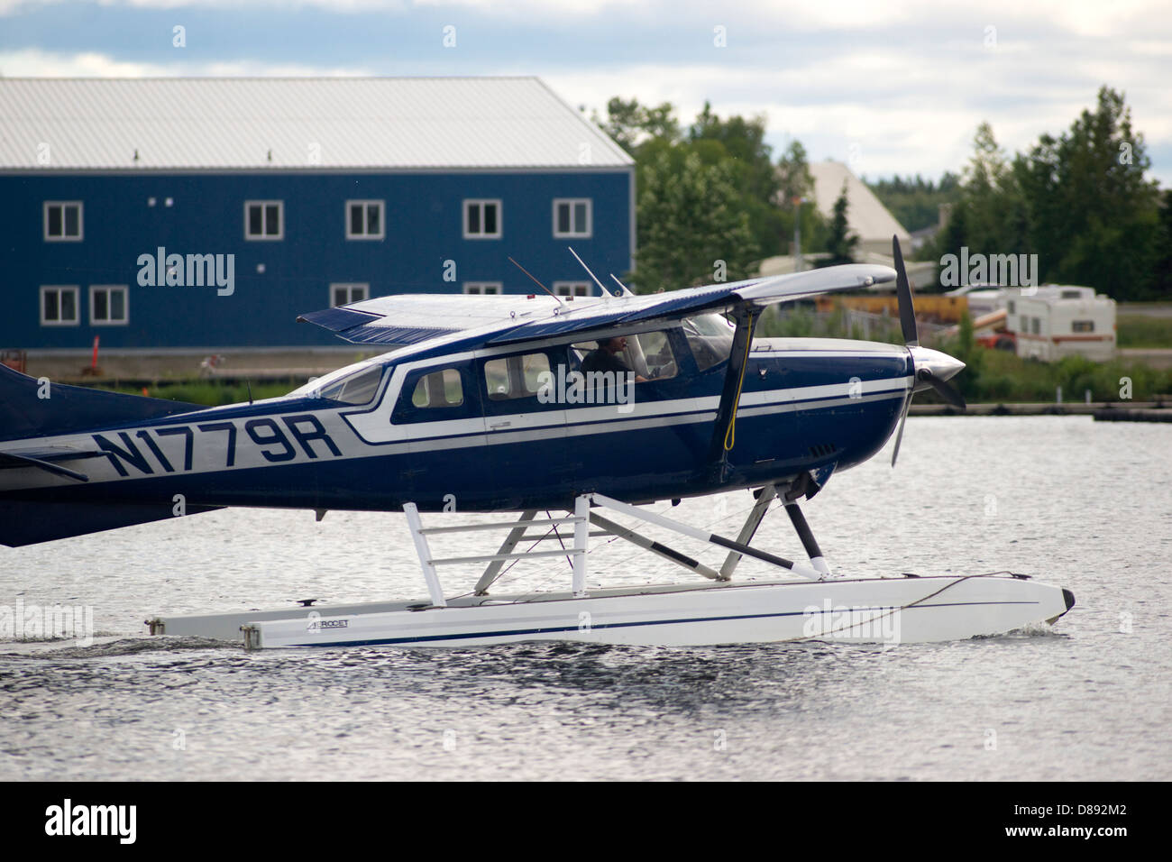 Floatplane moves into position for take off near Ted Stevens National Airport Stock Photo