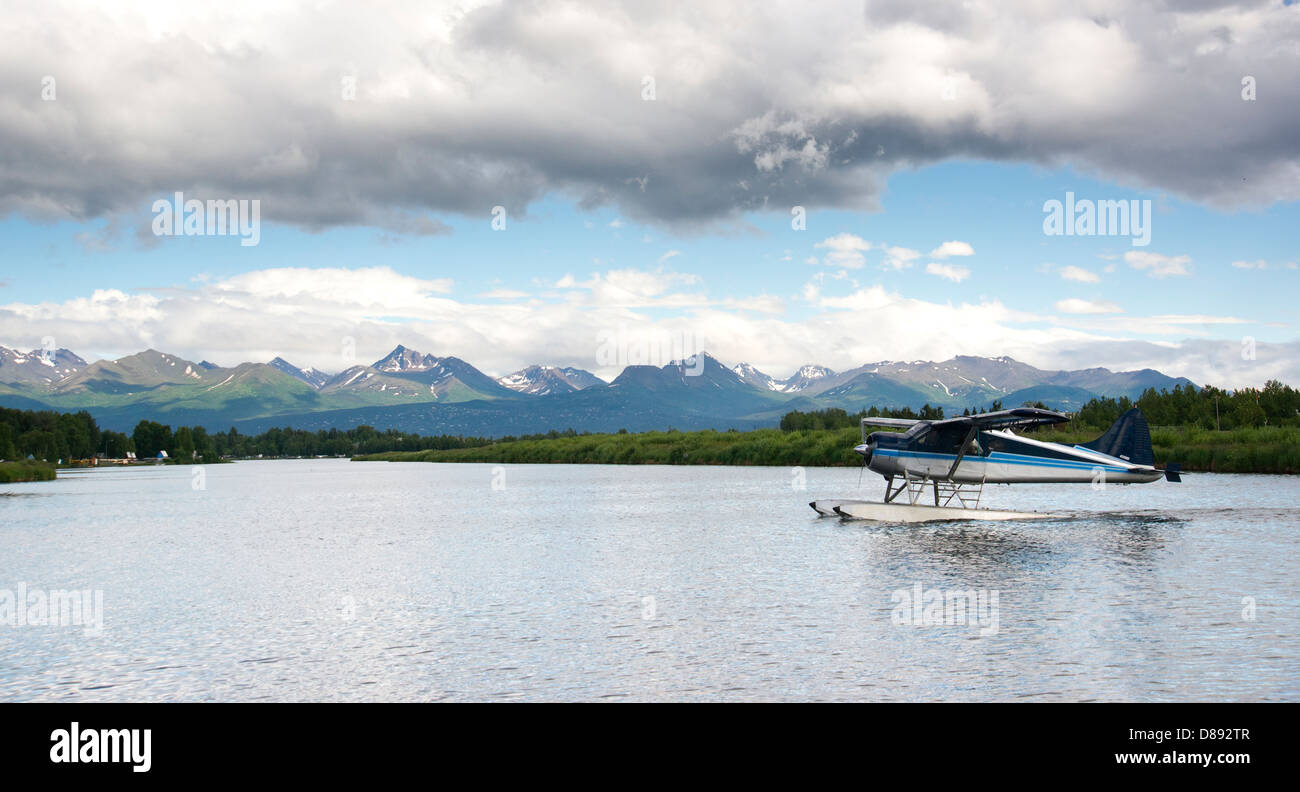 Floatplane comes in for a landing near Ted Stevens National Airport Stock Photo