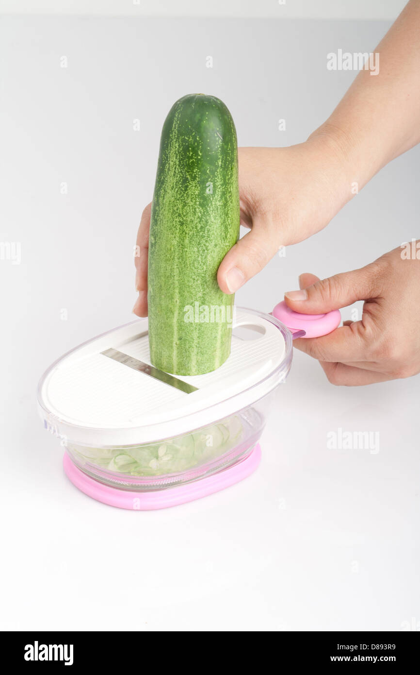 https://c8.alamy.com/comp/D893R9/manual-machine-for-slicing-cucumber-and-vegetables-D893R9.jpg