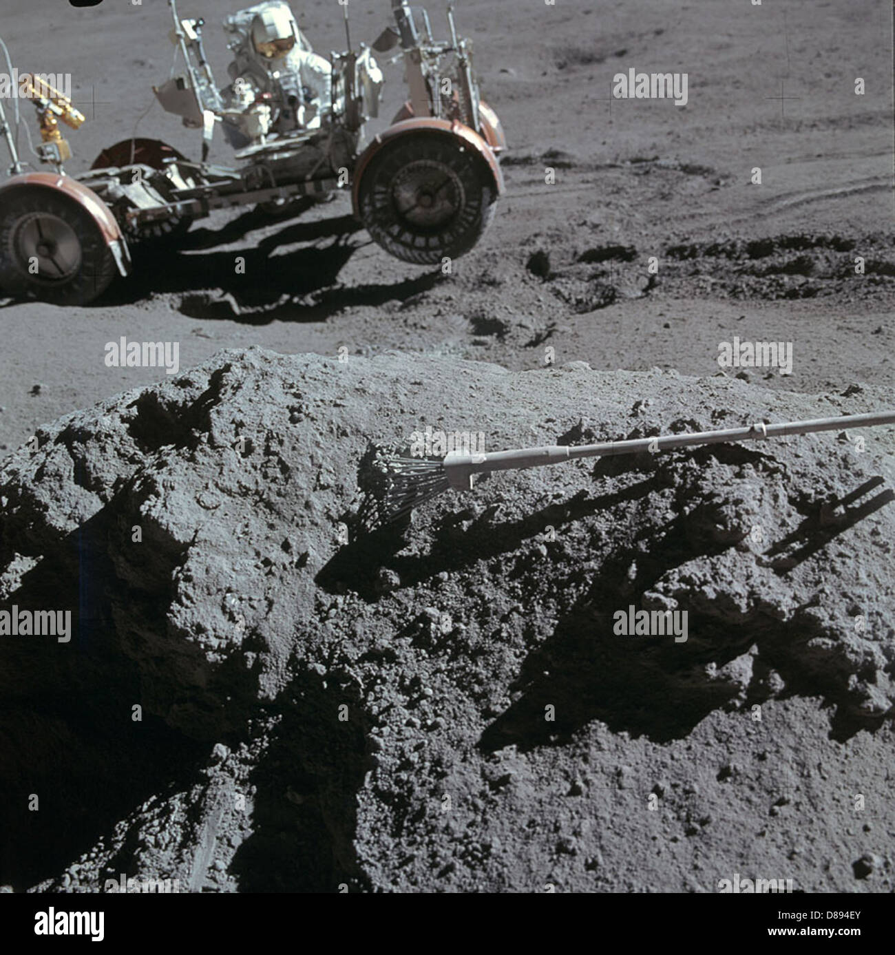 Apollo 15 astronaut James Irwin holds a green rock near the Lunar ...