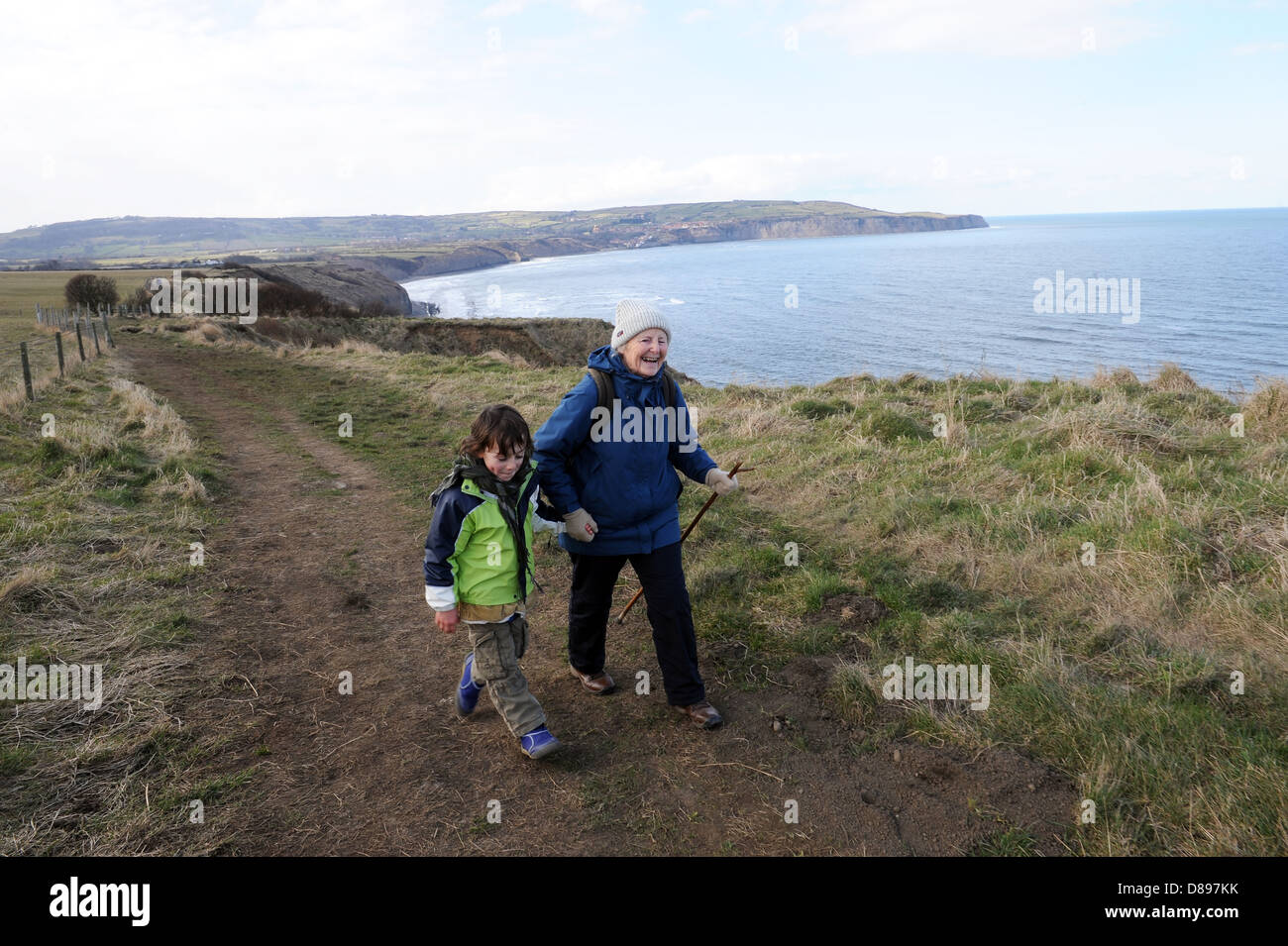 Grandparent and grandson rambling together on part of the Cleveland way footpath, North Yorkshire, england , uk Stock Photo