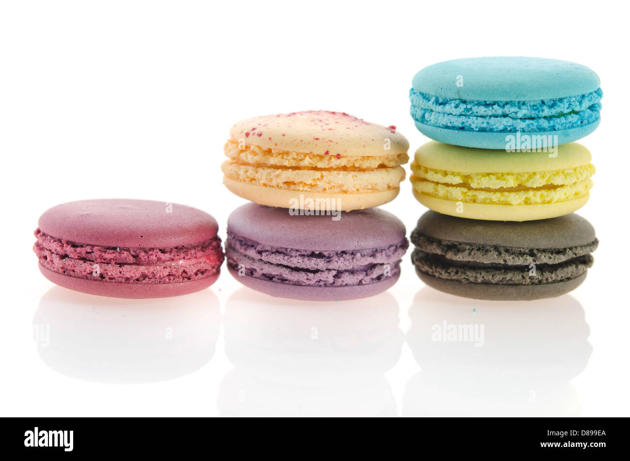 Colorful macaroon stack on white background with reflection Stock Photo