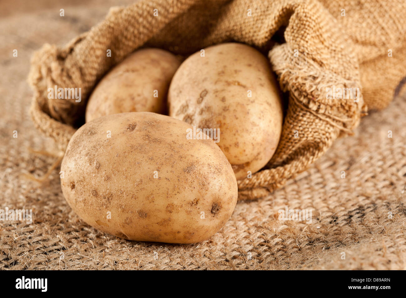 Fresh Organic Whole Potato on a background Stock Photo