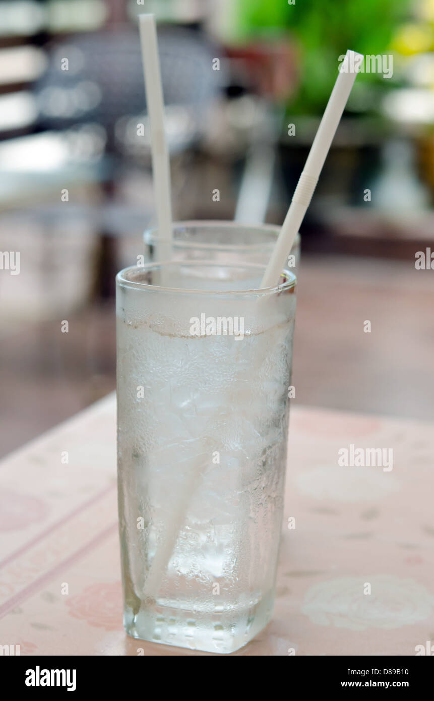 Water in glass with ice on table in restaurant Stock Photo
