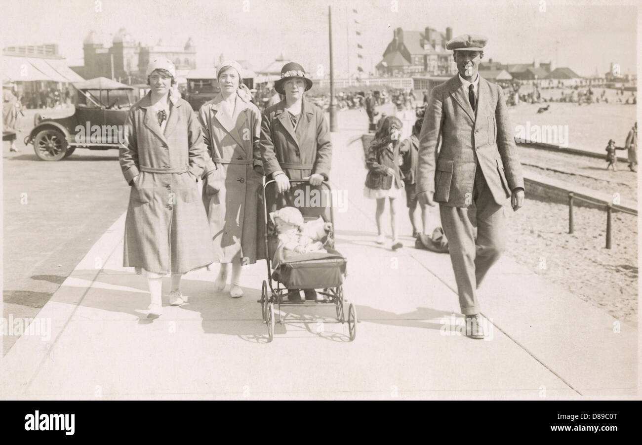 Family strolling along sea front with baby, 1930s Stock Photo