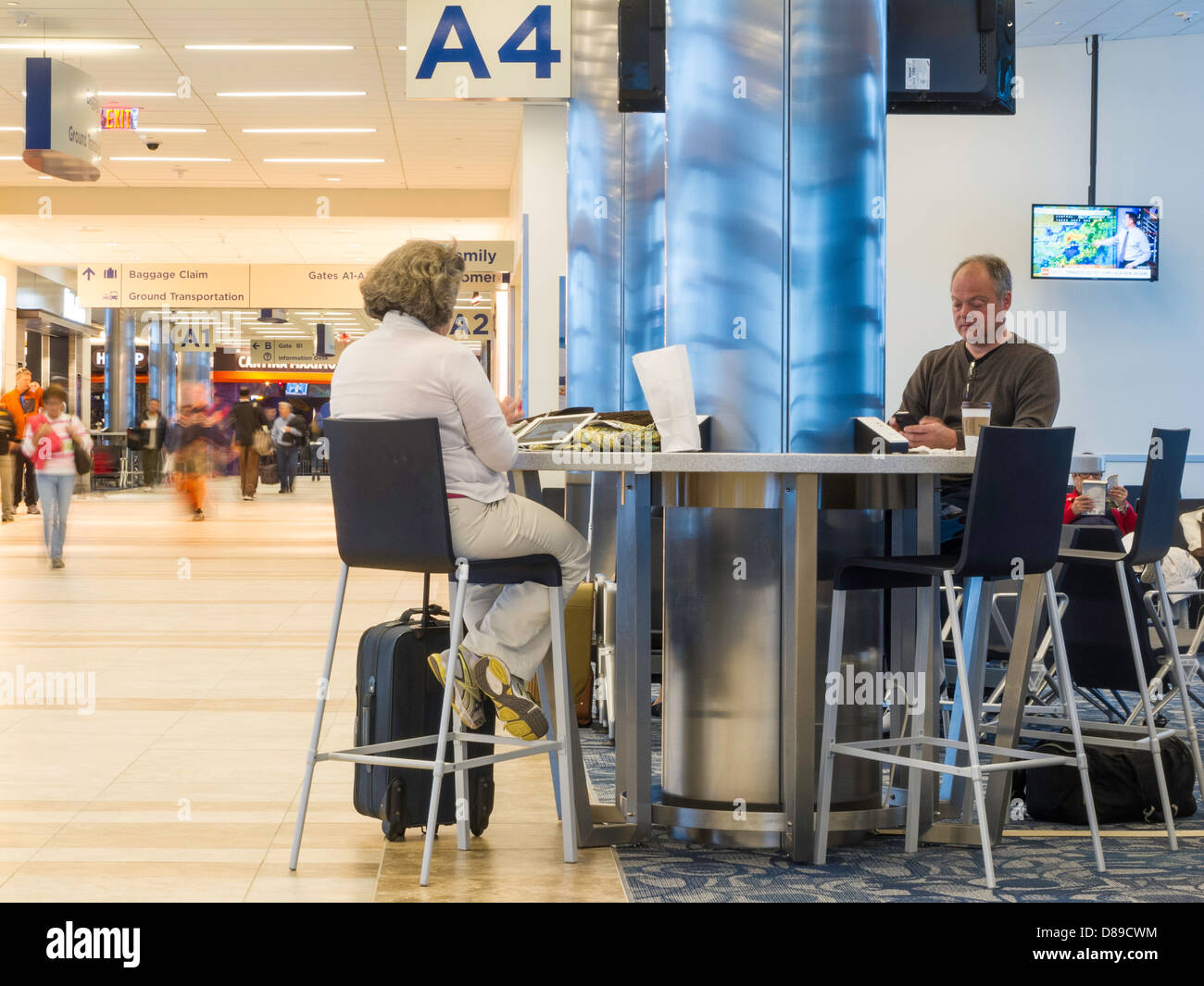 Travelers at Power Station in Myrtle Beach International Airport, SC Stock Photo