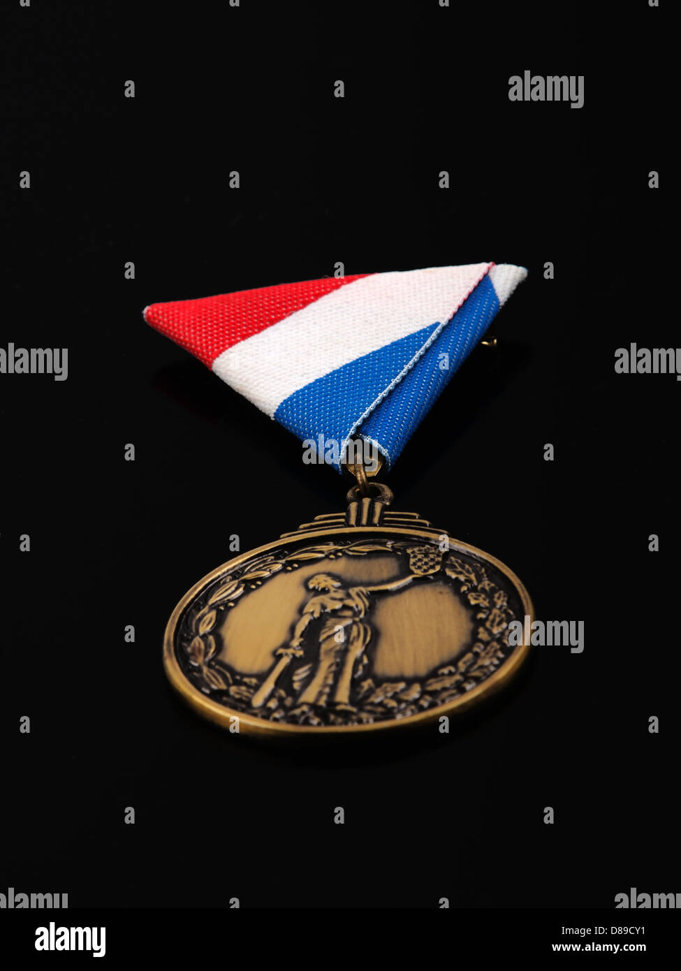 bronze medal for war heroes; isolated on black background Stock Photo
