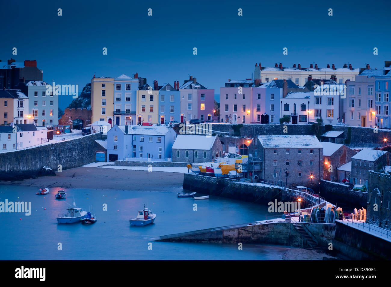 Winter snow at Tenby Harbour Tenby Pembrokeshire Wales at twilight Stock Photo