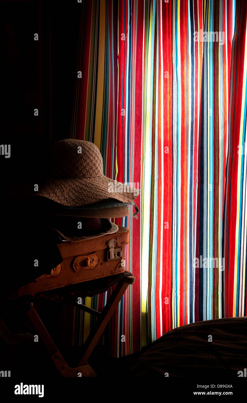Stripes and Hats and Case, Thaxted,Essex,England,UK. May 2013 Seen in the photographers bedroom. Stock Photo