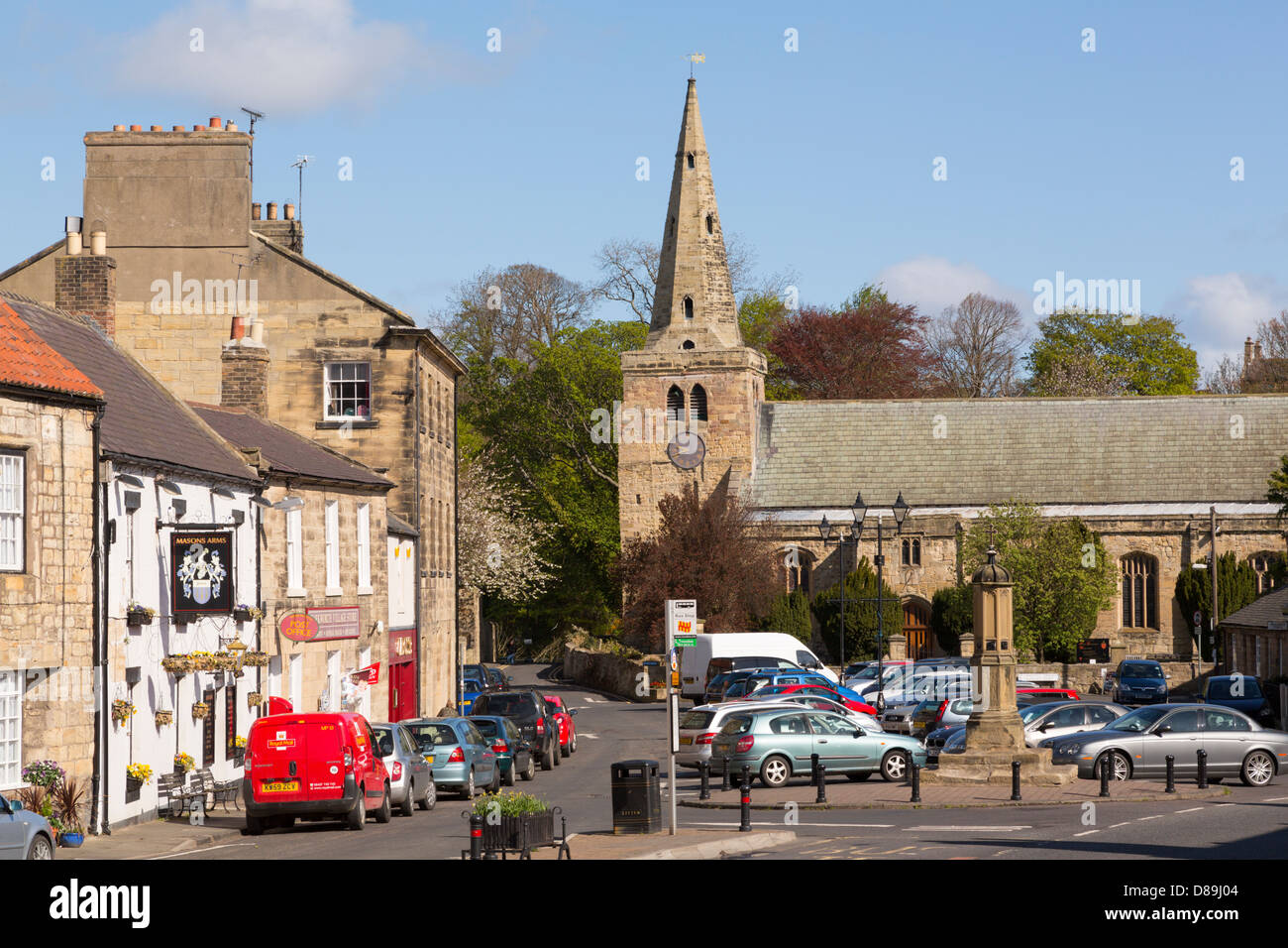 Warkworth village centre, with the Norman church of St Lawrence Stock
