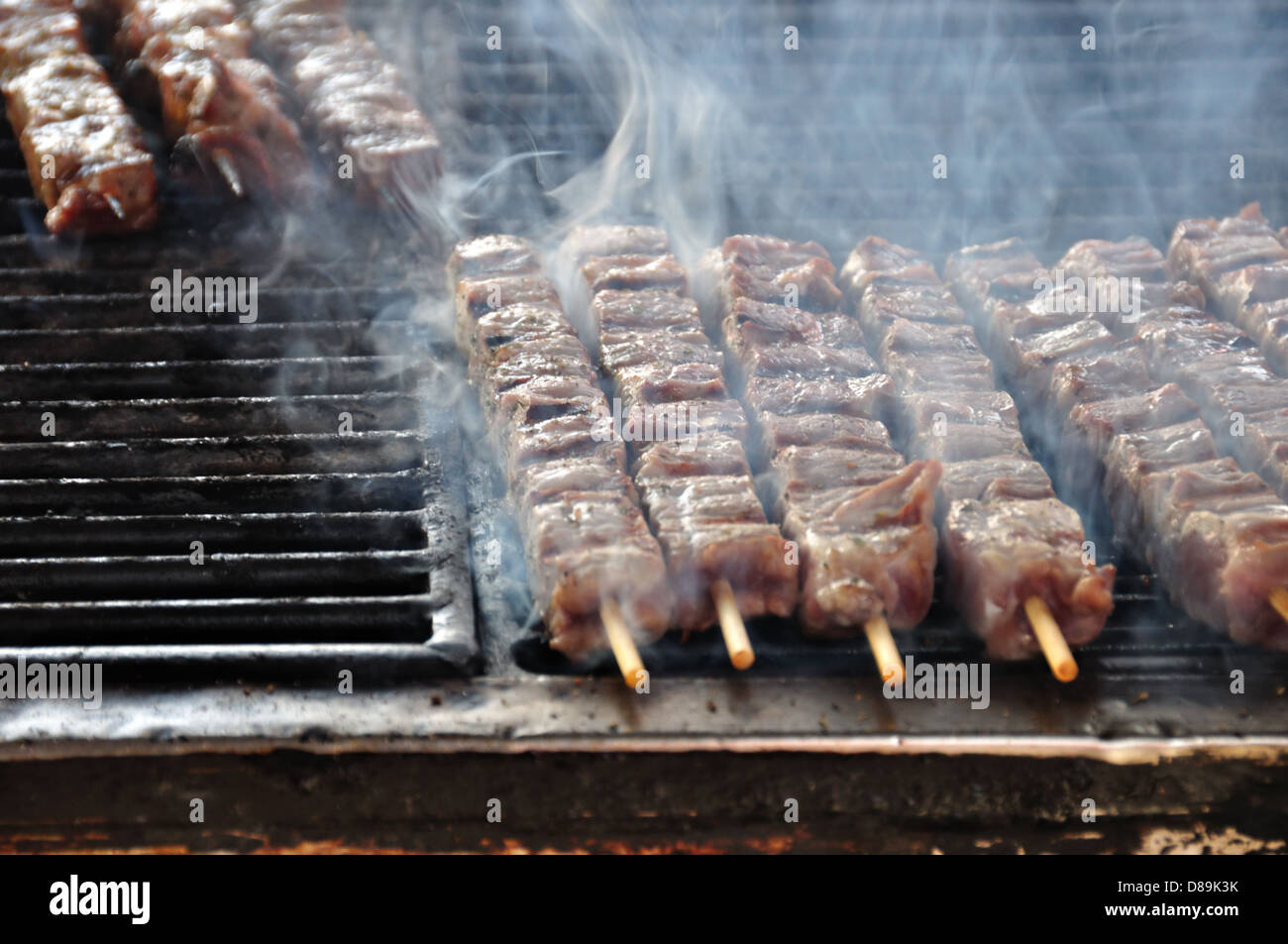 Souvlaki meat skewers on hot grill. Greek food background Stock Photo -  Alamy