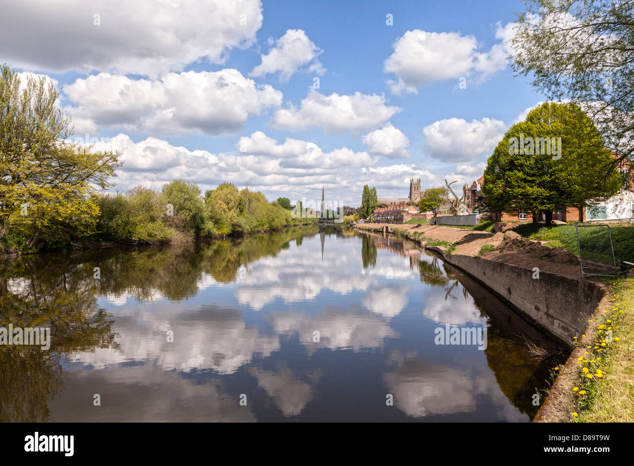 A fine spring day on the River Severn at Worcester, England, with clouds reflecting in the water. Stock Photo