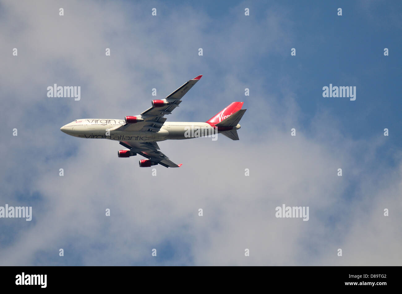 Virgin Airlines Boeing 747 jumbo jet flying directly overhead Stock Photo