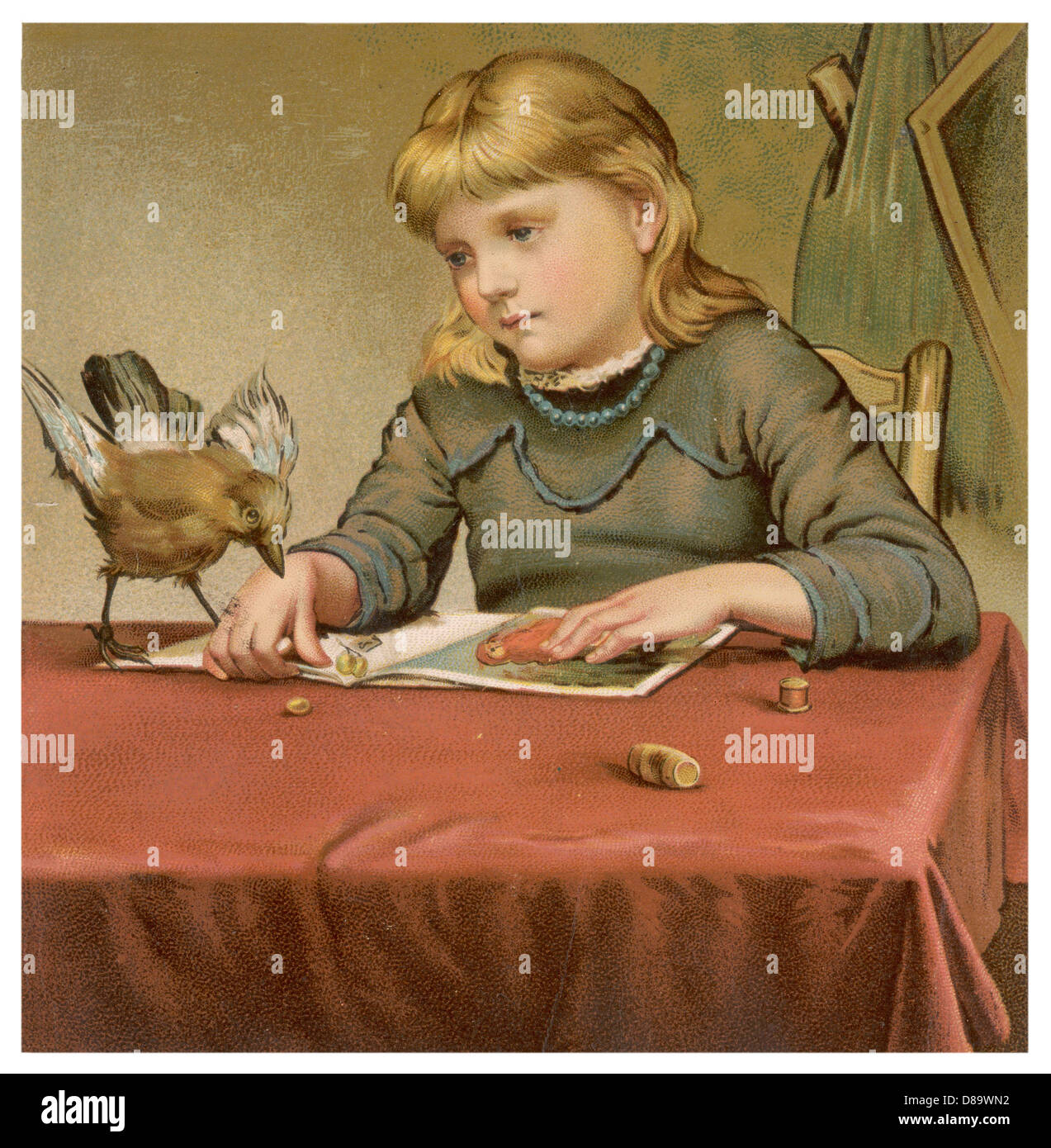 GIRL AND BIRD ON TABLE Stock Photo