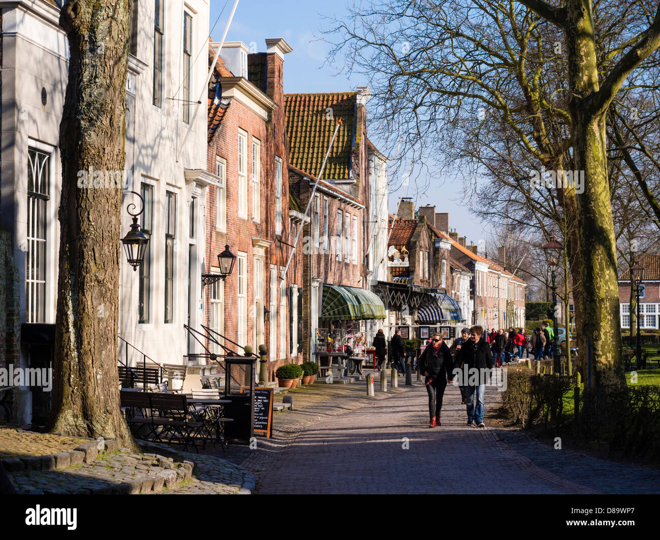 Visitors walk through the centre of Veere, the street called Markt. Stock Photo