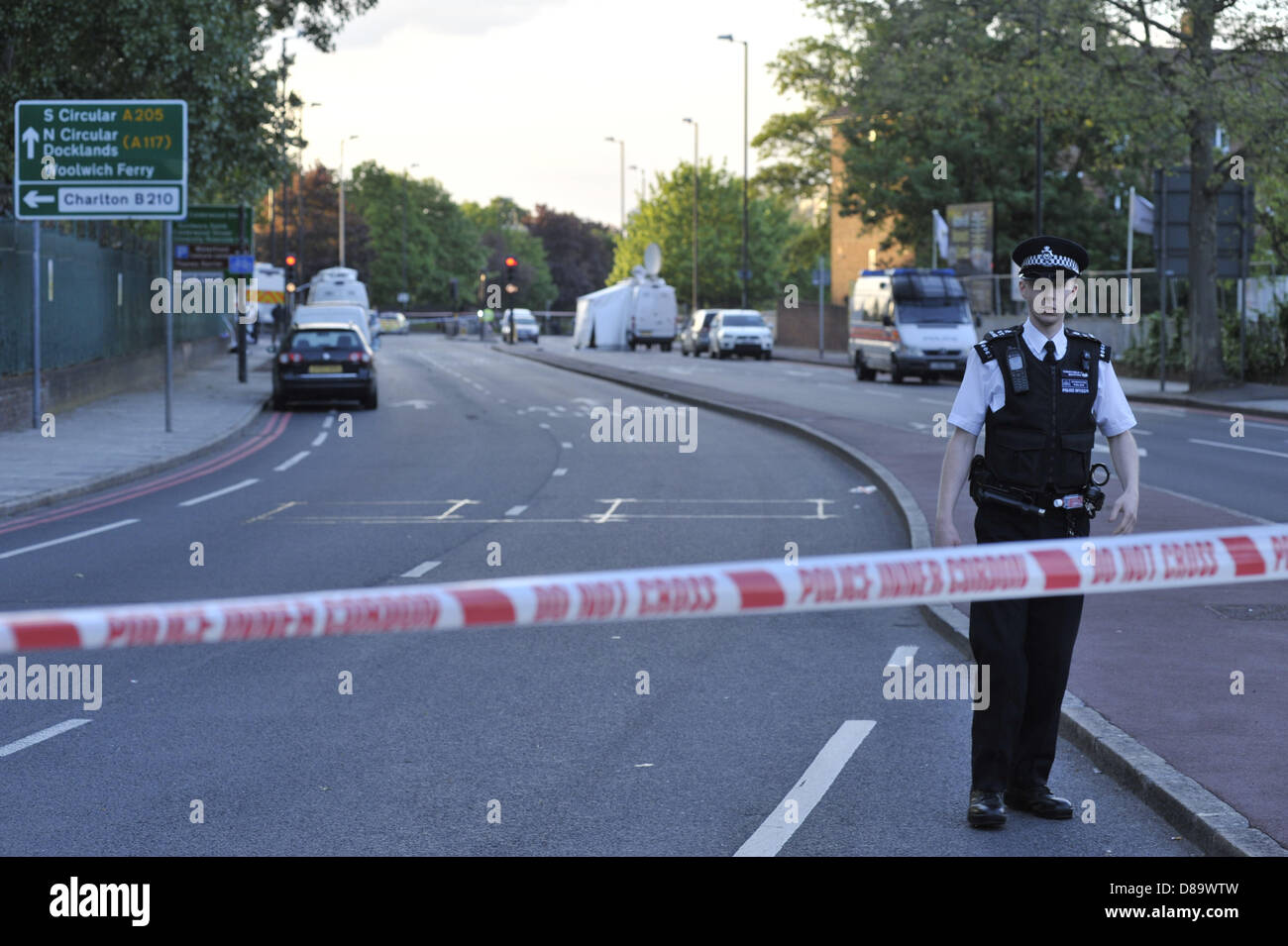 London, UK, 22nd May, 2013. This is the scene at John Wilson Street, Woolwich, a few hours after a man was killed by two suspects who in turn were both shot by police. The road has been cordoned off and a heavy police presence is in place. Credit: Lee Thomas/Alamy Live News Stock Photo