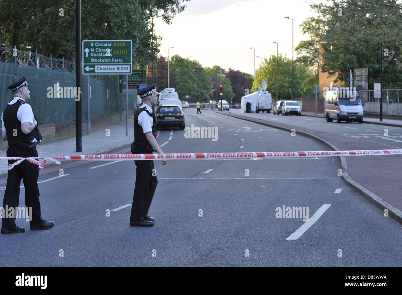 London, UK, 22nd May, 2013. This is the scene at John Wilson Street, Woolwich, a few hours after a man was killed by two suspects who in turn were both shot by police. The road has been cordoned off and a heavy police presence is in place. Credit: Lee Thomas/Alamy Live News Stock Photo