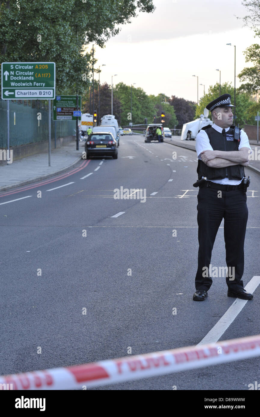 London, UK, 22nd May, 2013. This is the scene at John Wilson Street, Woolwich, a few hours after a man was killed by two suspects who in turn were both shot by police. The road has been cordoned off and a heavy police presence is in place. Credit: Lee Thomas/Alamy Live News Stock Photo