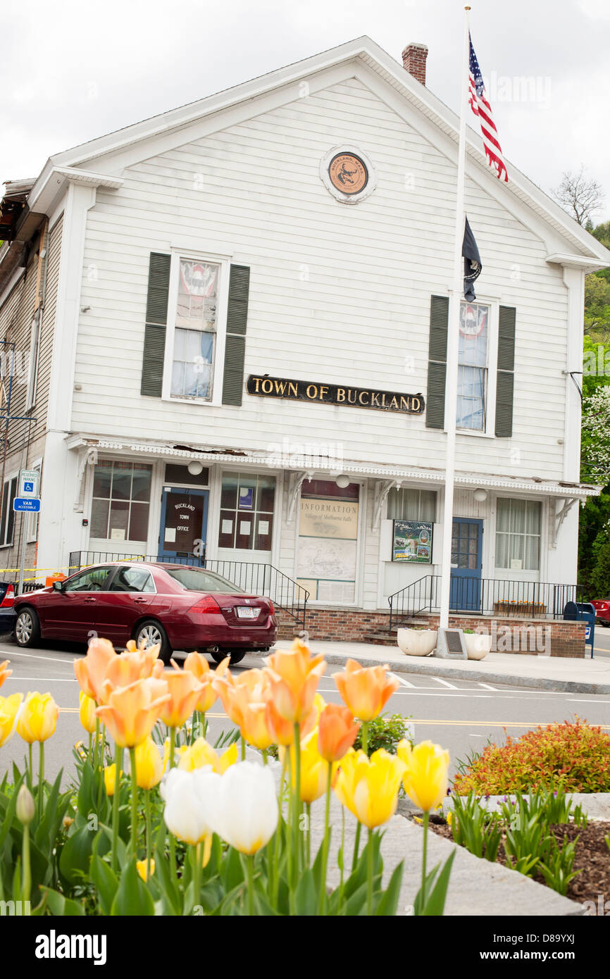 The town hall of Buckland, Massachusetts faces the famous Shelburne Falls Bridge of Flowers. Stock Photo