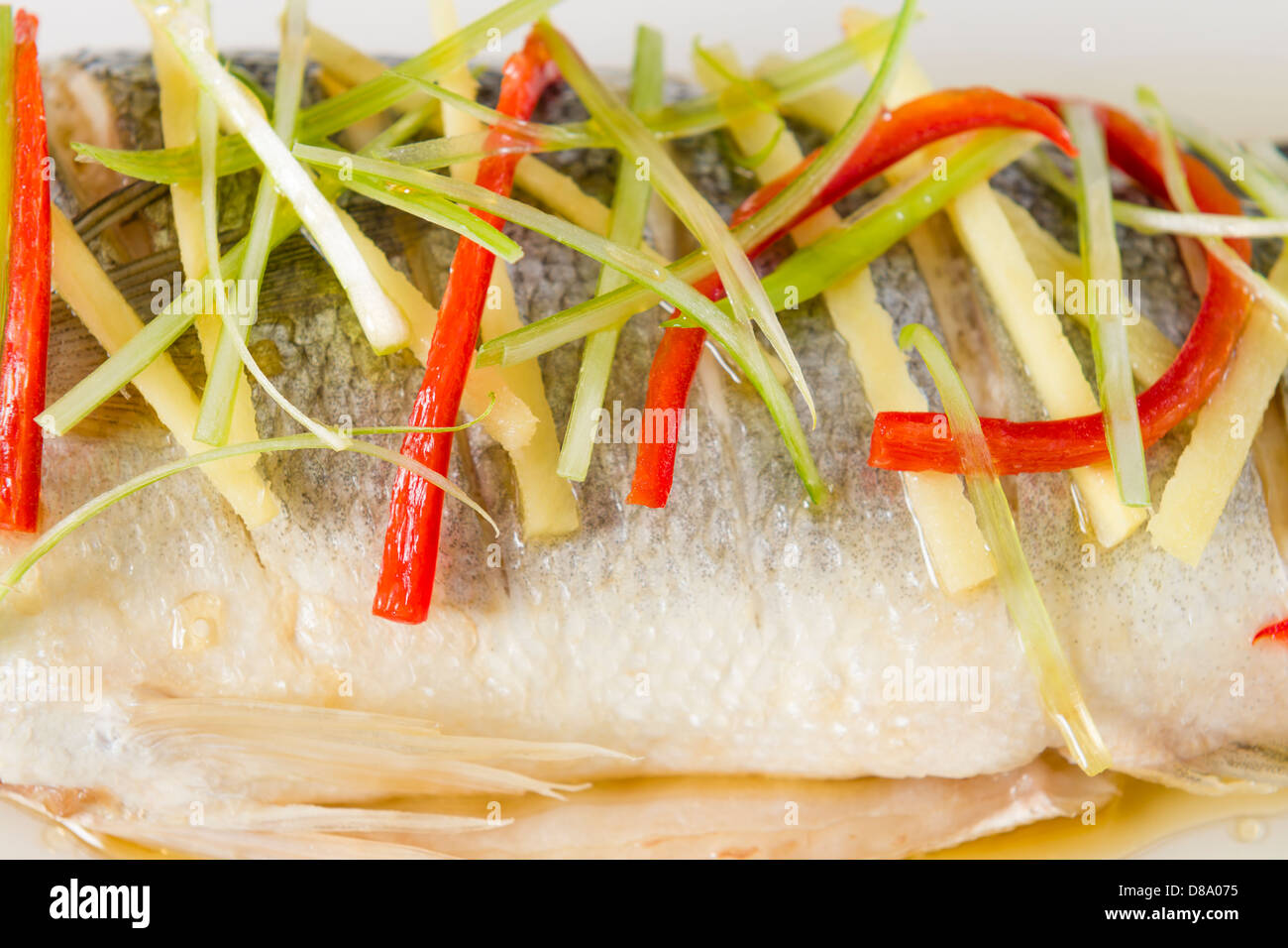 Steamed Fish Chinese style steamed sea bass garnished with ginger