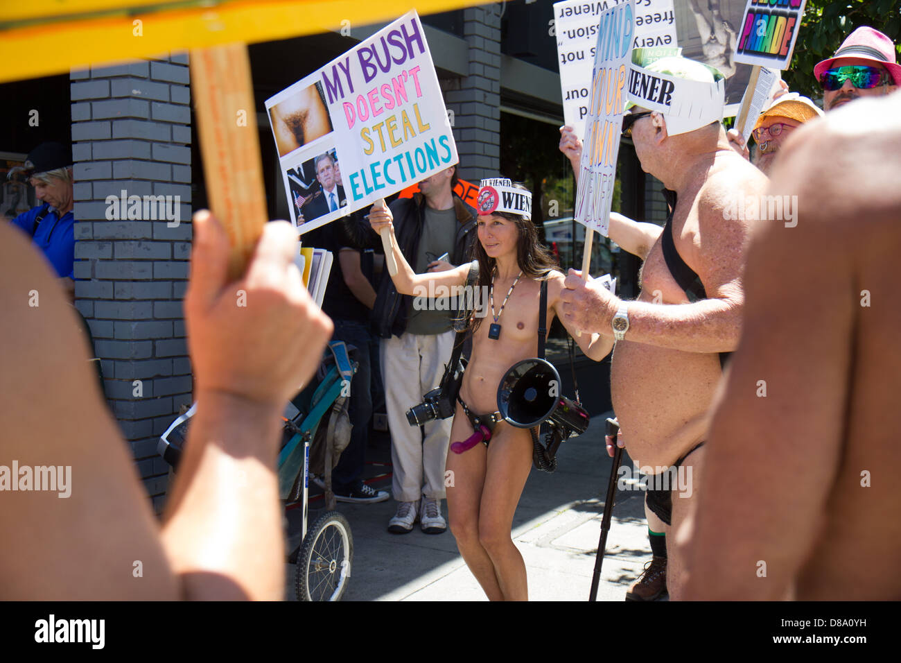 Gypsy Taub (center) and nudity activists demonstrate against the recent cit...