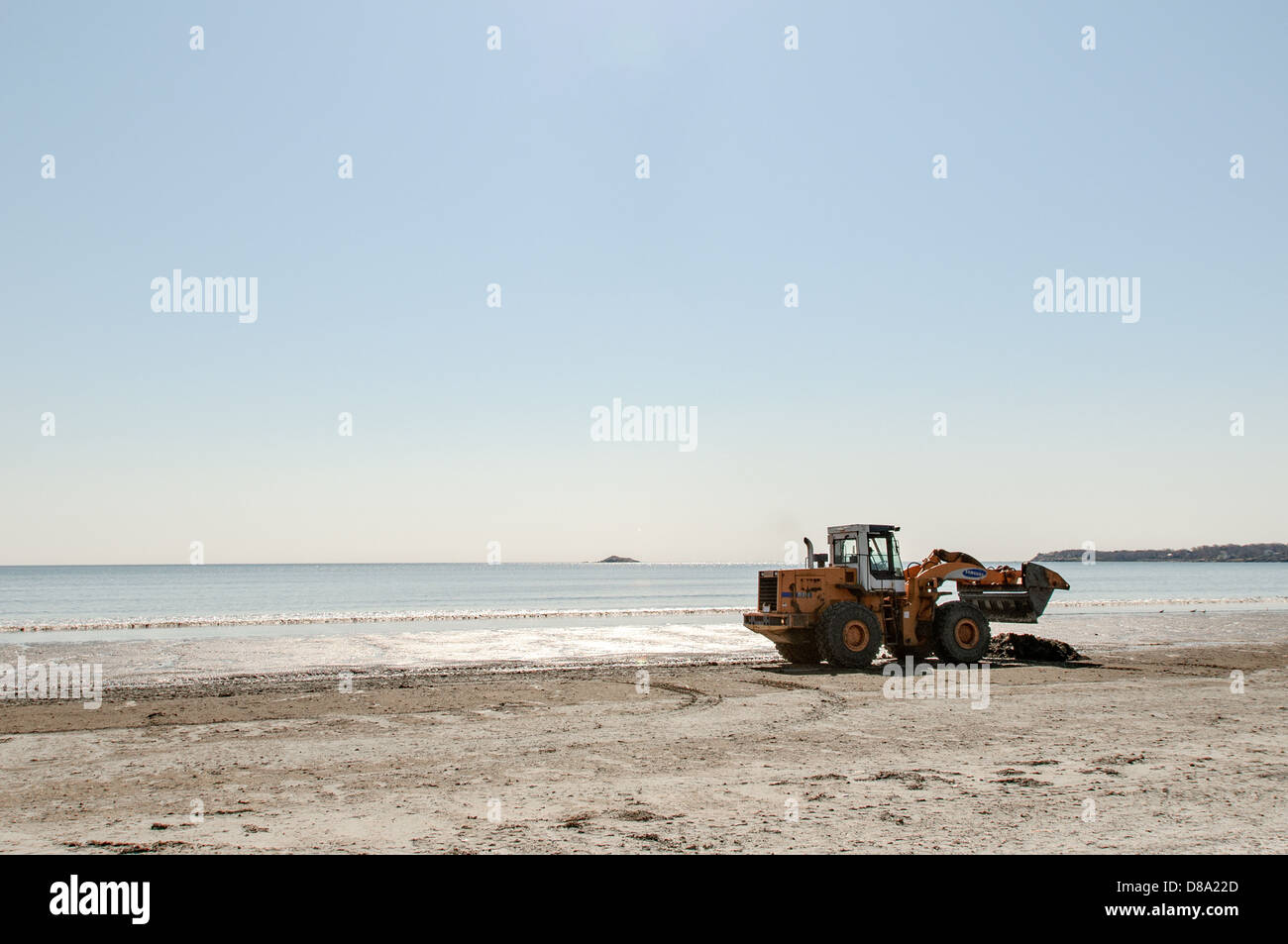 An excavator on the beach Stock Photo - Alamy