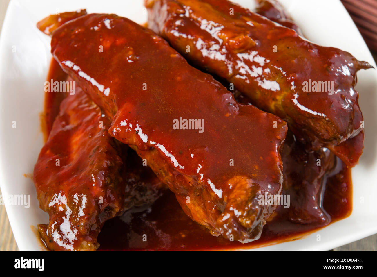 Char Siu - Chinese sticky pork spare ribs roasted with a sweet and savoury sauce. Stock Photo