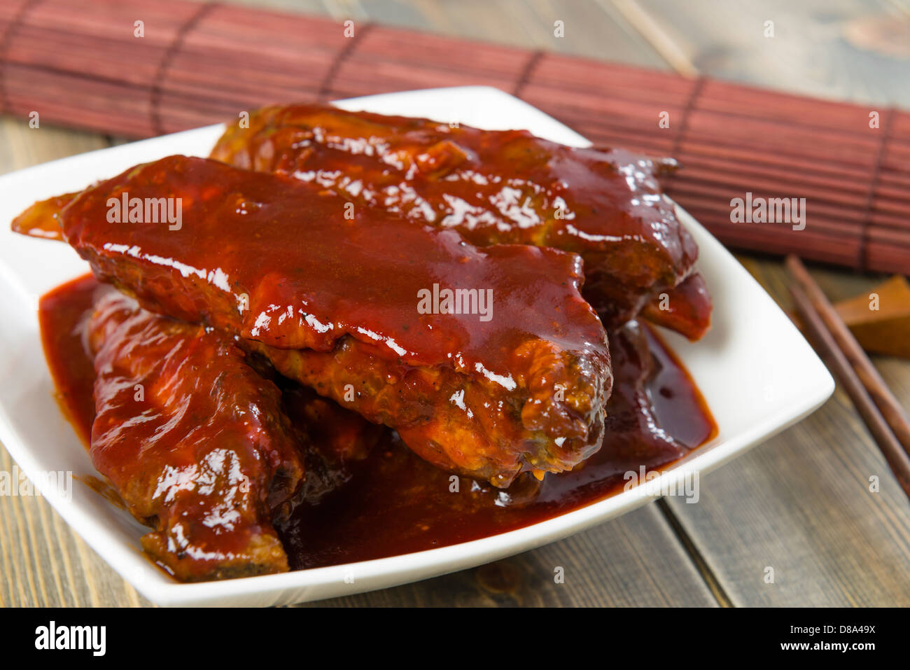 Char Siu - Chinese sticky pork spare ribs roasted with a sweet and savoury sauce. Stock Photo