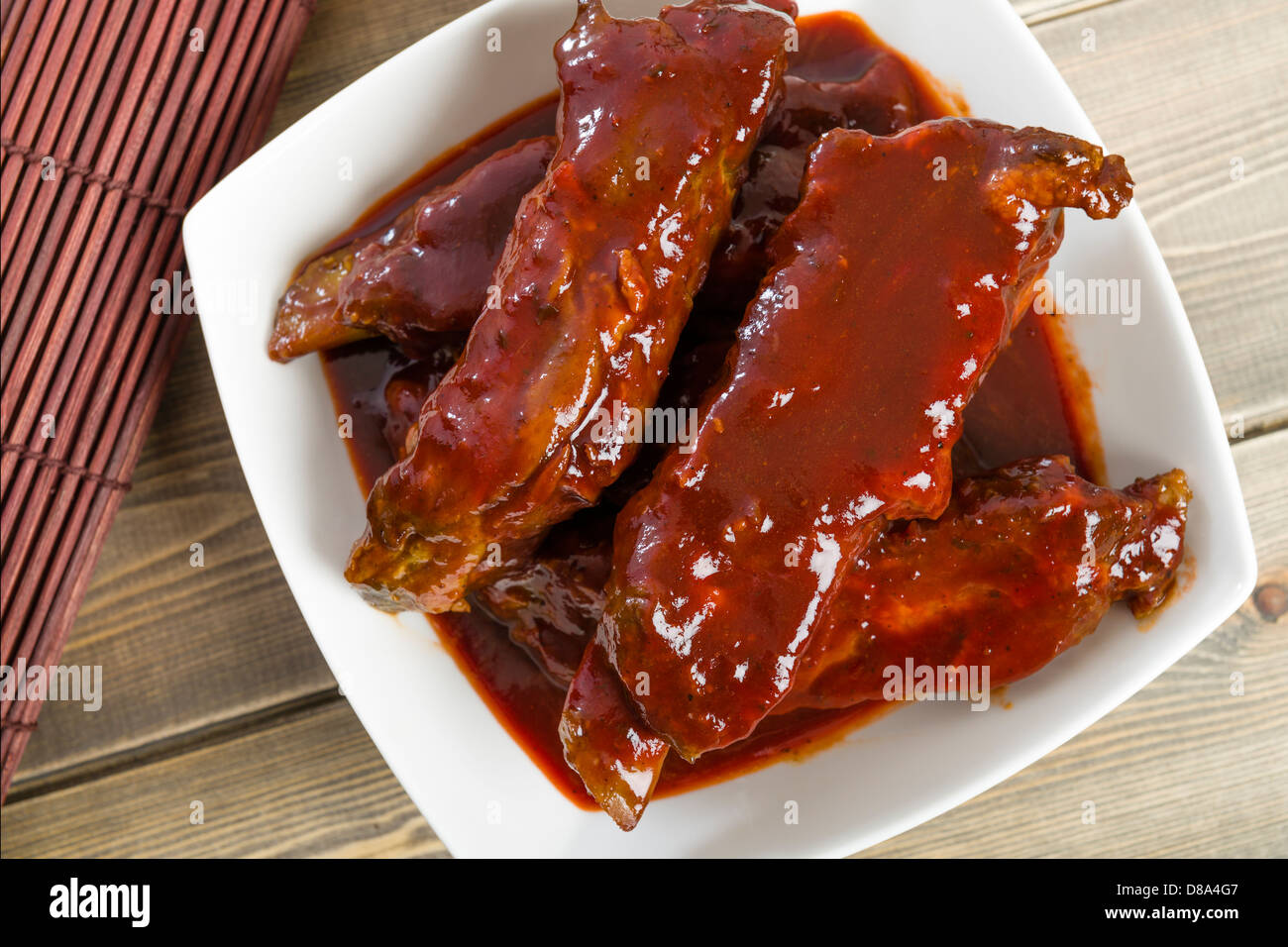 Char Siu - Chinese sticky pork spare ribs roasted with a sweet and savoury sauce. Stock Photo