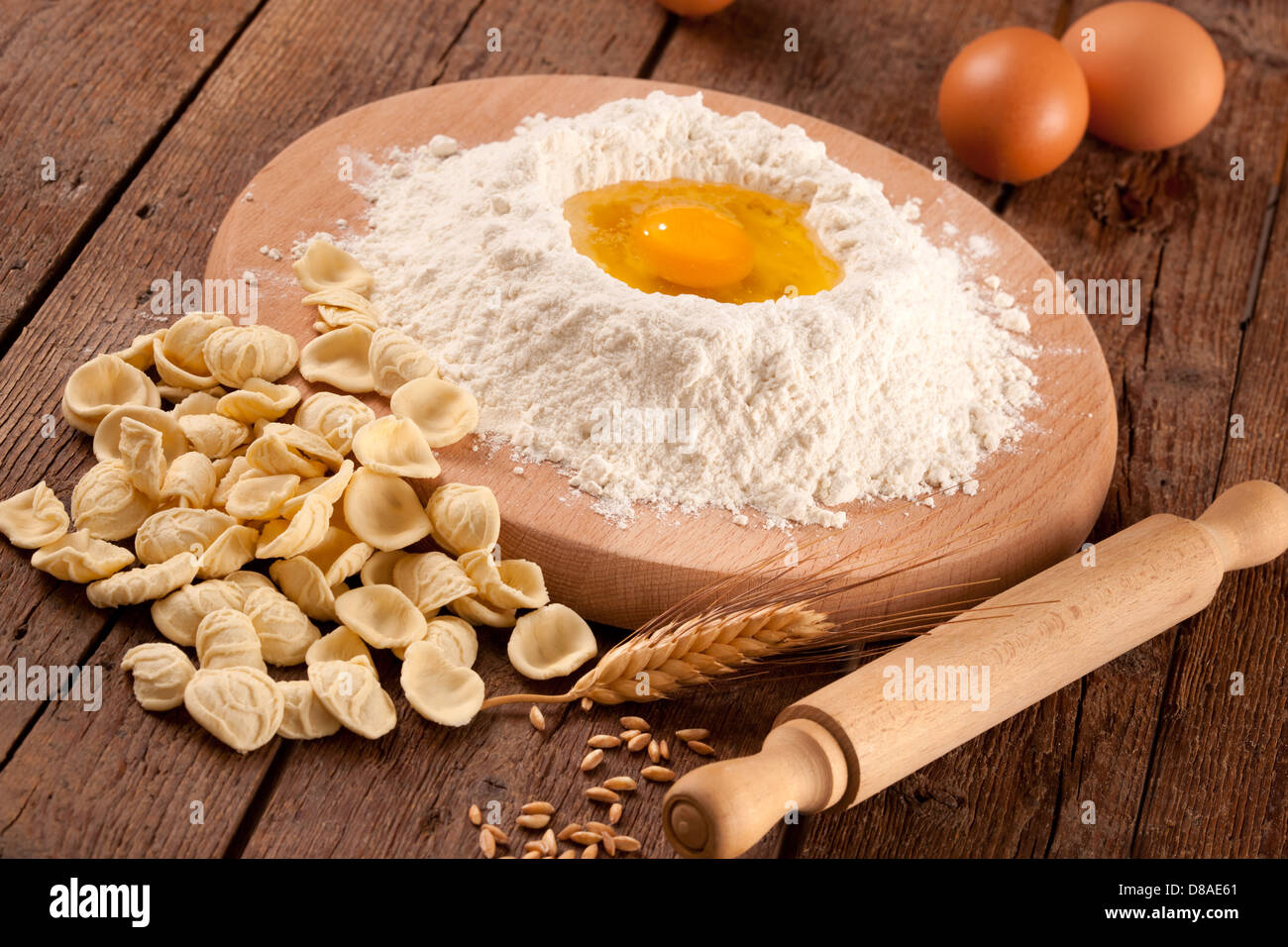 Italian pasta orecchiette homemade on wooden table Stock Photo