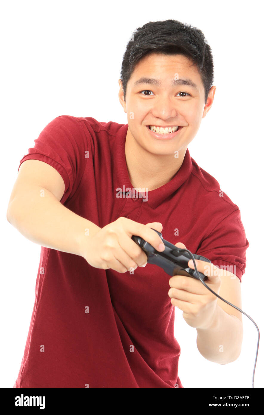 A teenager holding a game controller Stock Photo Alamy