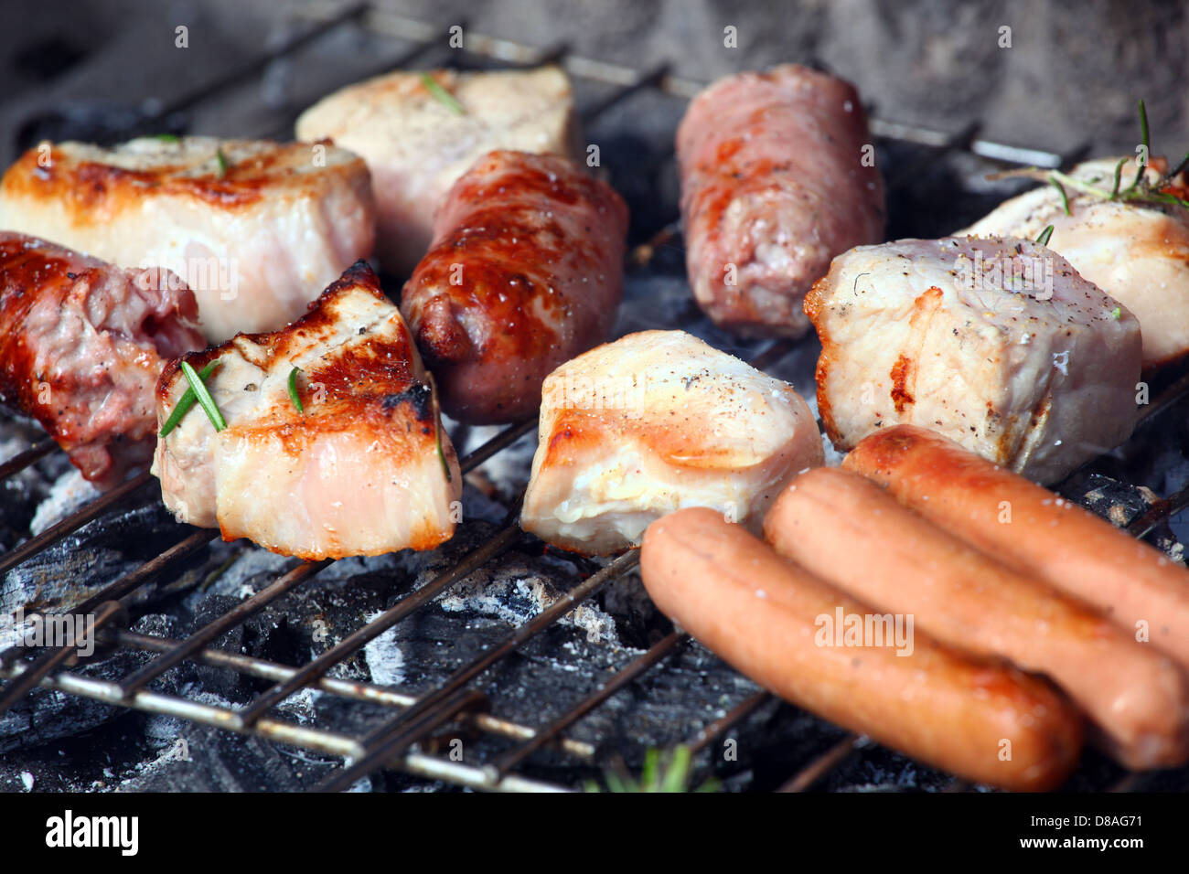 Closeup of a barbecue grill with chicken and meat Stock Photo - Alamy