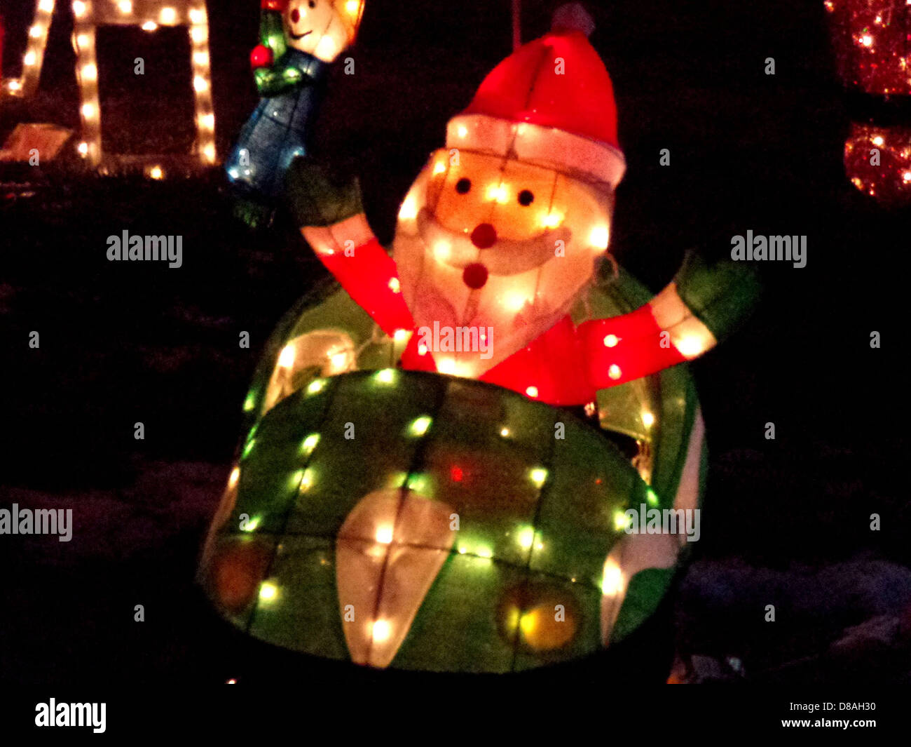 santa in race car christmas lights decoration Stock Photo Alamy
