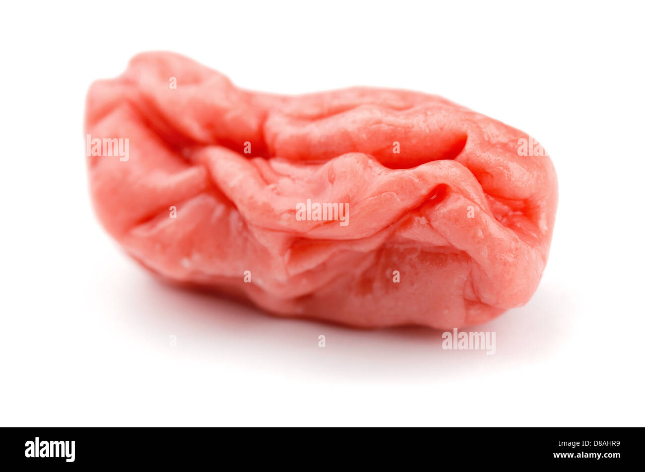 Piece of pink chewed bubble gum isolated on white Stock Photo