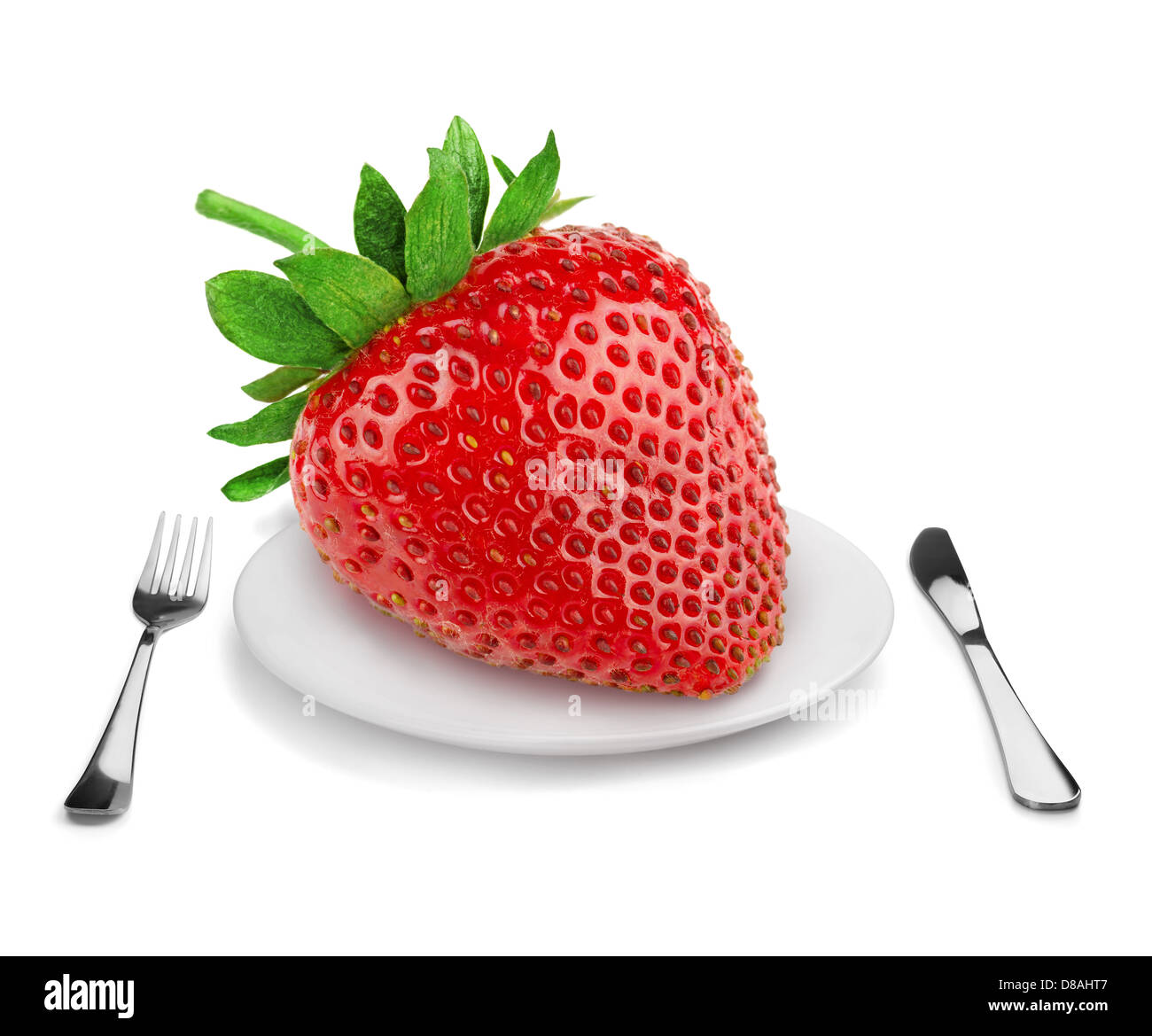 Giant strawberry on a plate - dieting concept. Isolated on white. Stock Photo
