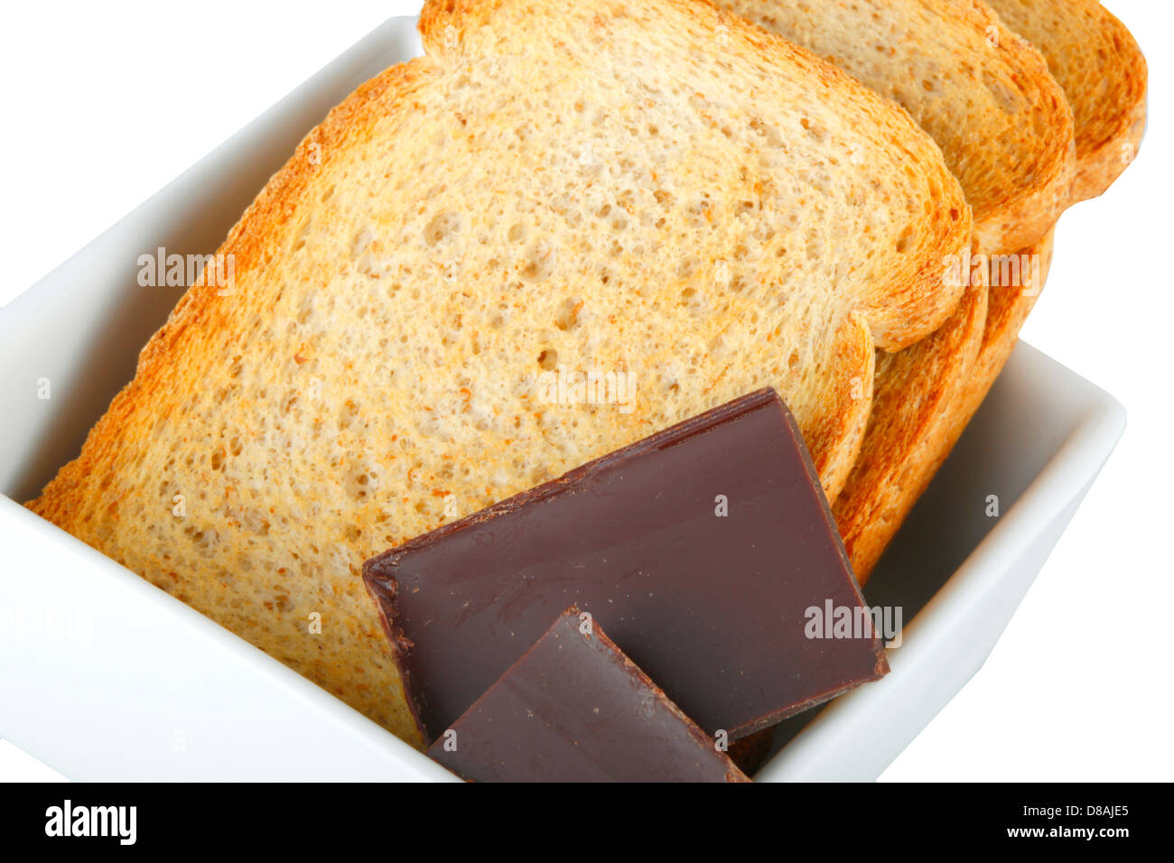 Chunks chocolate with crispbread on white Stock Photo