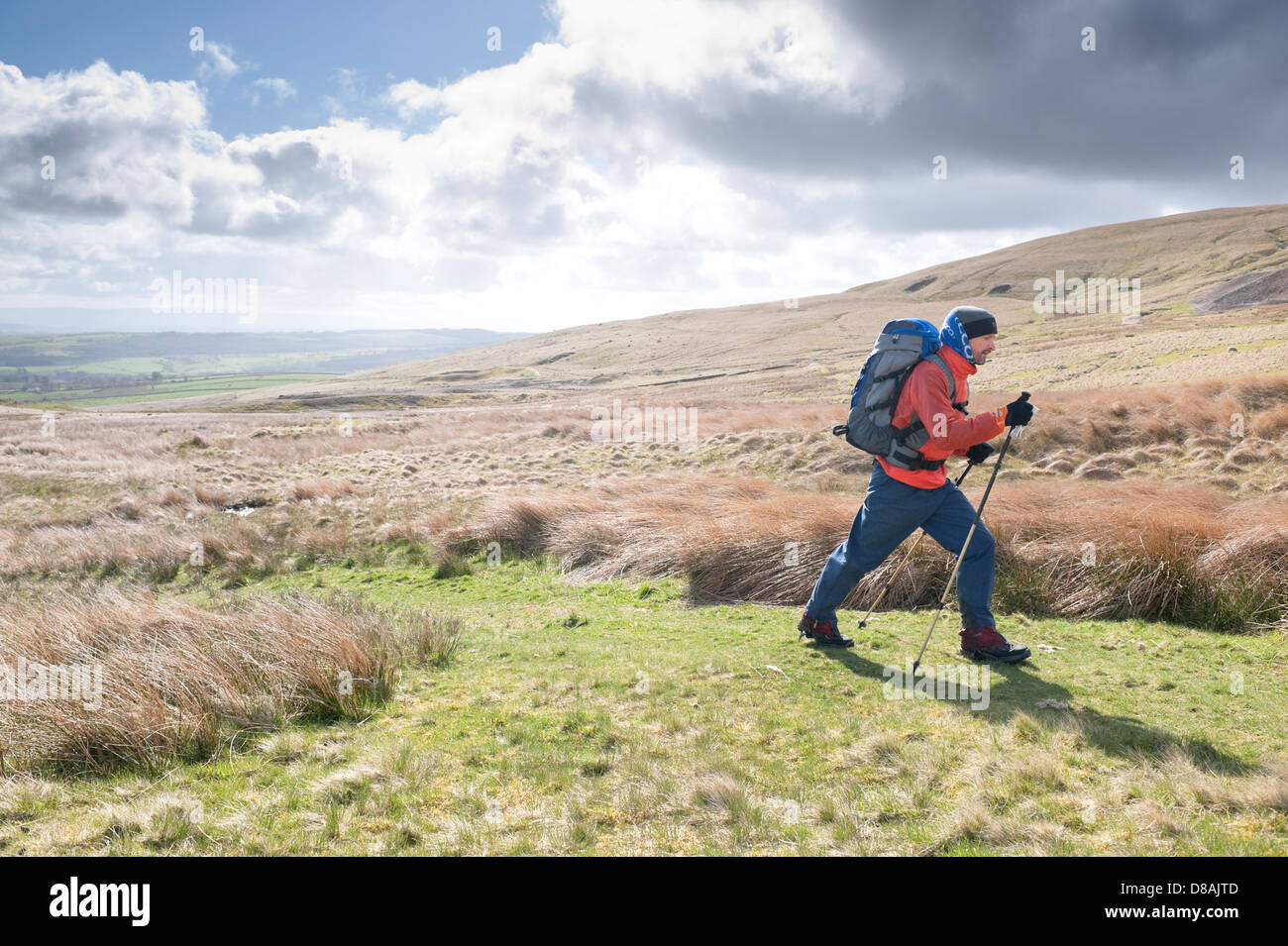 A man walking on High Pike in the English Lake District, part of Wainwrights Northern Fells group Stock Photo