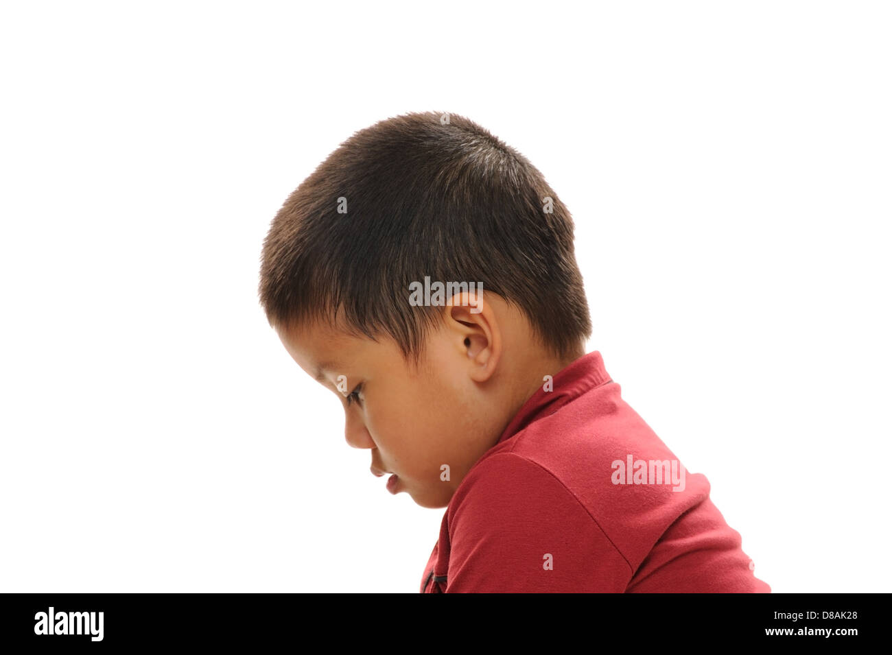Asian boy looking sad profile view with red shirt Stock Photo - Alamy
