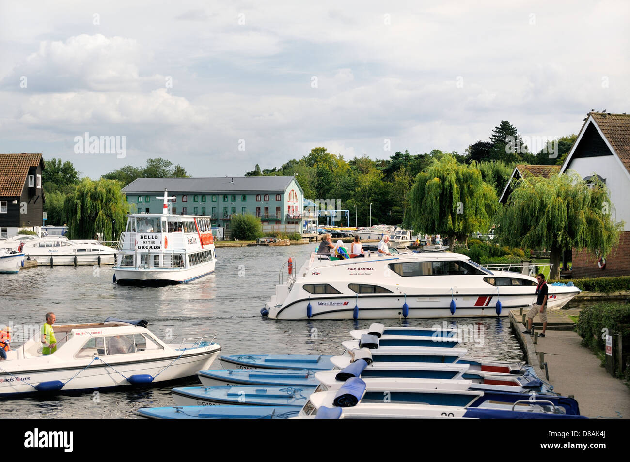 Pleasure boats and services on the River Bure in the town of Wroxham in the Norfolk Broads, England. Summer Stock Photo