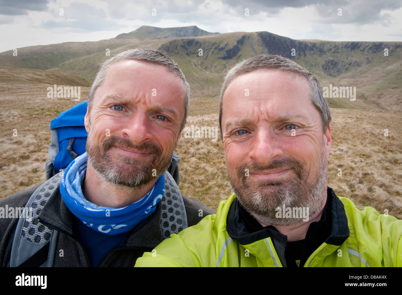 Identical twins on the top of Souther Fell in the English Lake District, during a walking holiday in the English Lake District Stock Photo