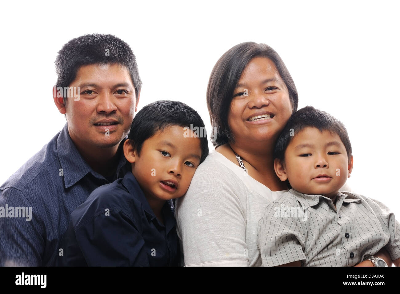 Asian family with two boys looking happy and smiling Stock Photo