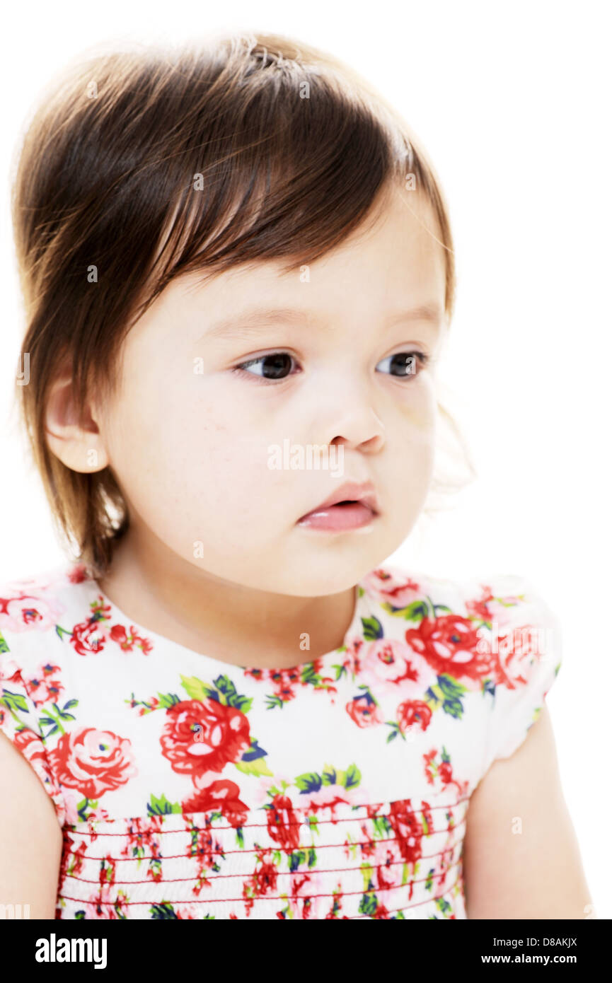 Young mixed race girl looks away and serious Stock Photo