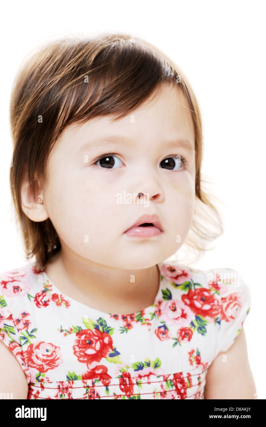 Young mixed race girl thinking and serious Stock Photo