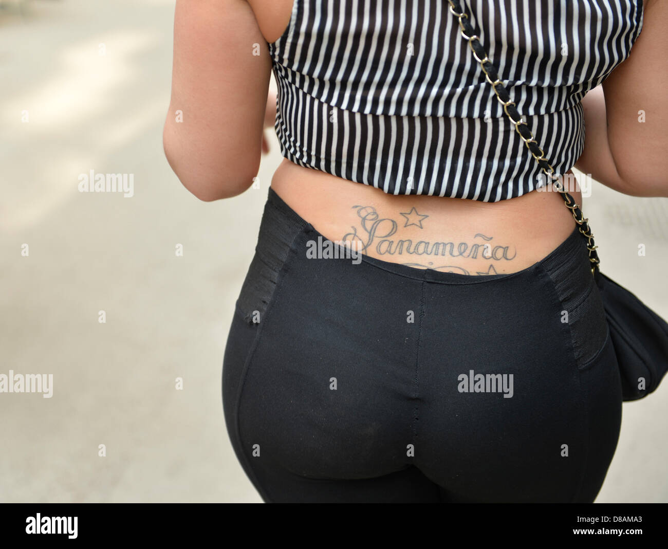 New York, USA. 21st May 2013. Woman seen from behind, with a tattoo ...