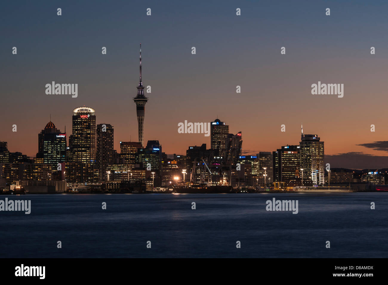 Downtown Auckland harbour and skyline including CBD and Sky Tower photographed from Devonport early evening.  New Zealand Stock Photo