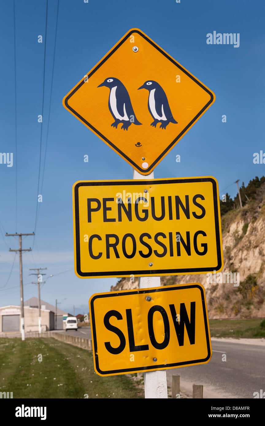 Penguins crossing warning sign by the road to penguin colonies on outskirts of Oamaru, South Island. New Zealand Stock Photo