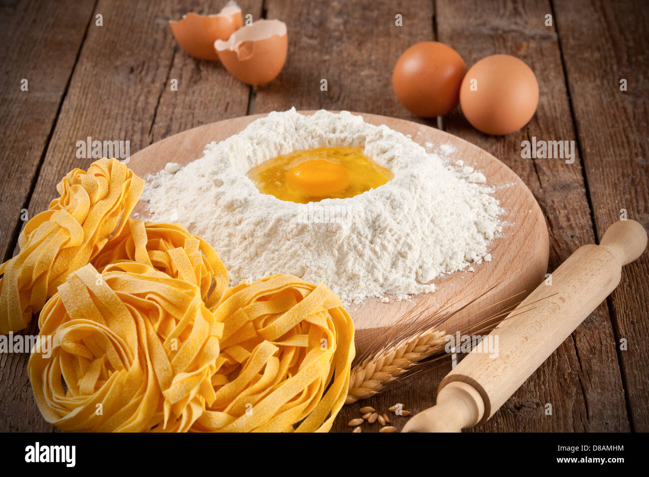 Italian pasta tagliatelle homemade on wooden table Stock Photo Alamy