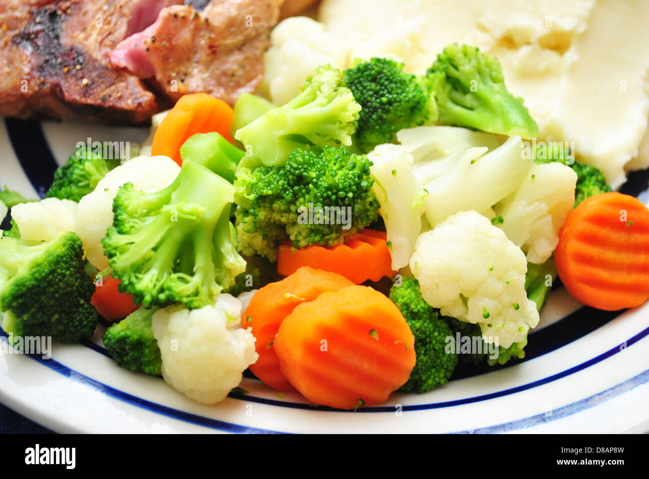Steamed Mixed Veggies; Broccoli, Cauliflower, and Carrots Stock Photo