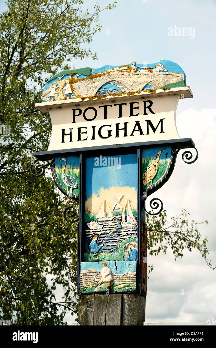 Norfolk, East Anglia village of Potter Heigham. Painted sign at village entrance showing bridge over River Thurne Stock Photo