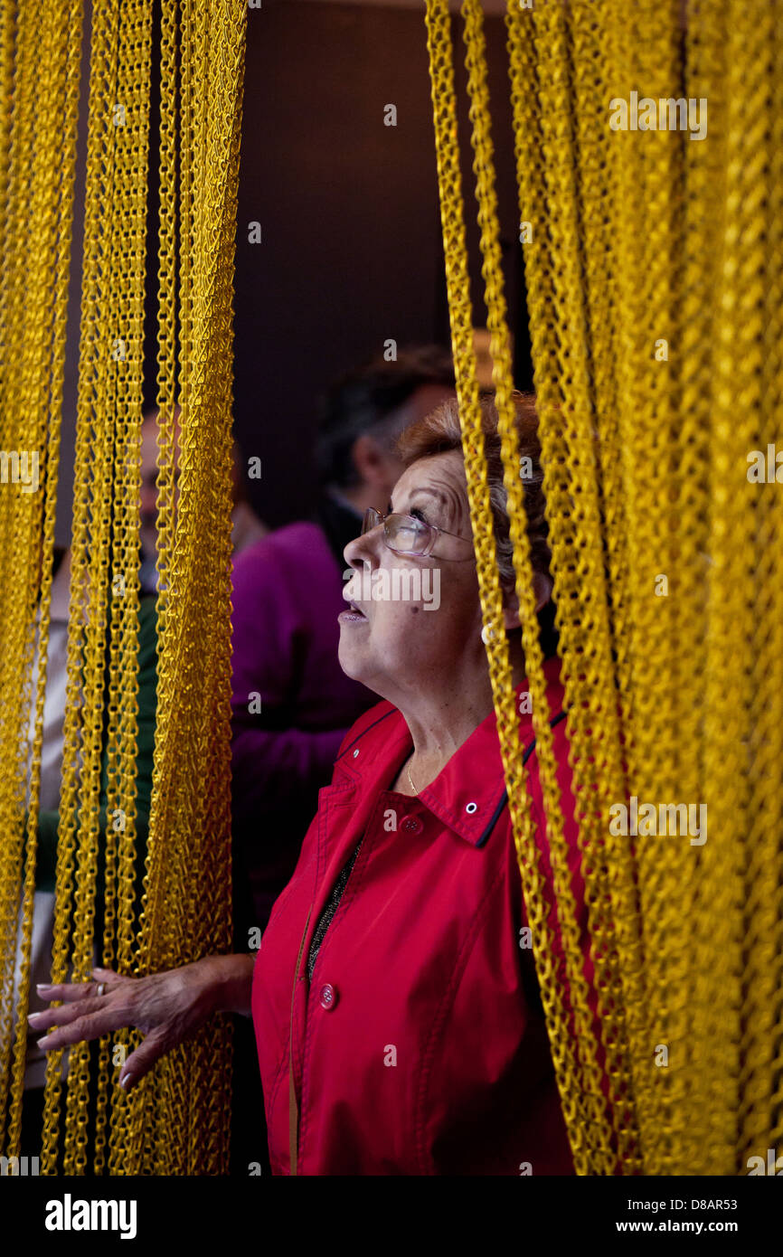 A woman looks an installation during Temps de Flors Stock Photo